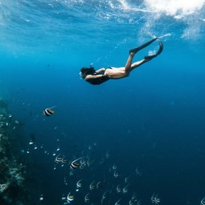 Mother diving during a Family Vacation in Maldives